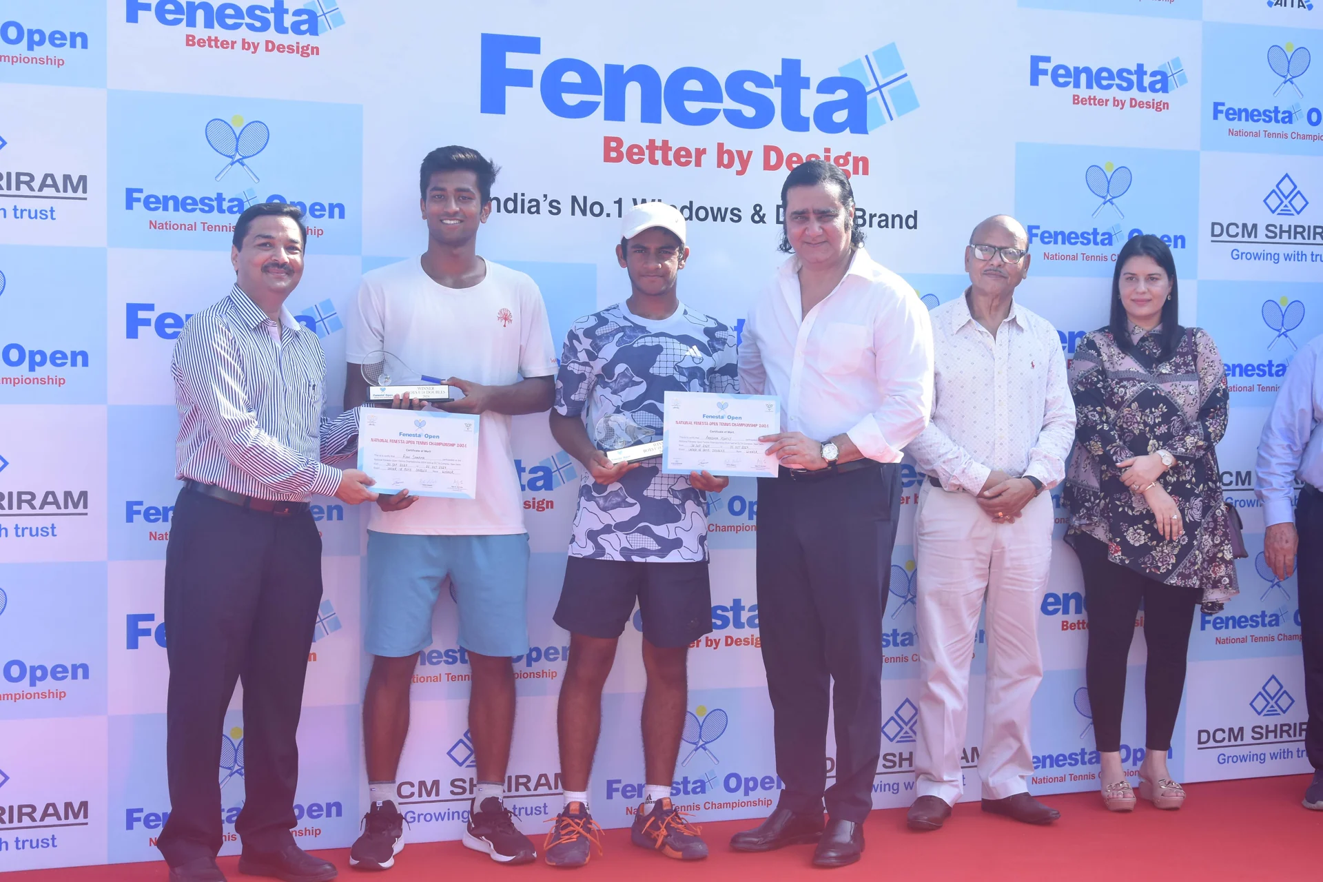 Rian Sharma, second from left, and Aradhya, third from left, with their doubles trophies.